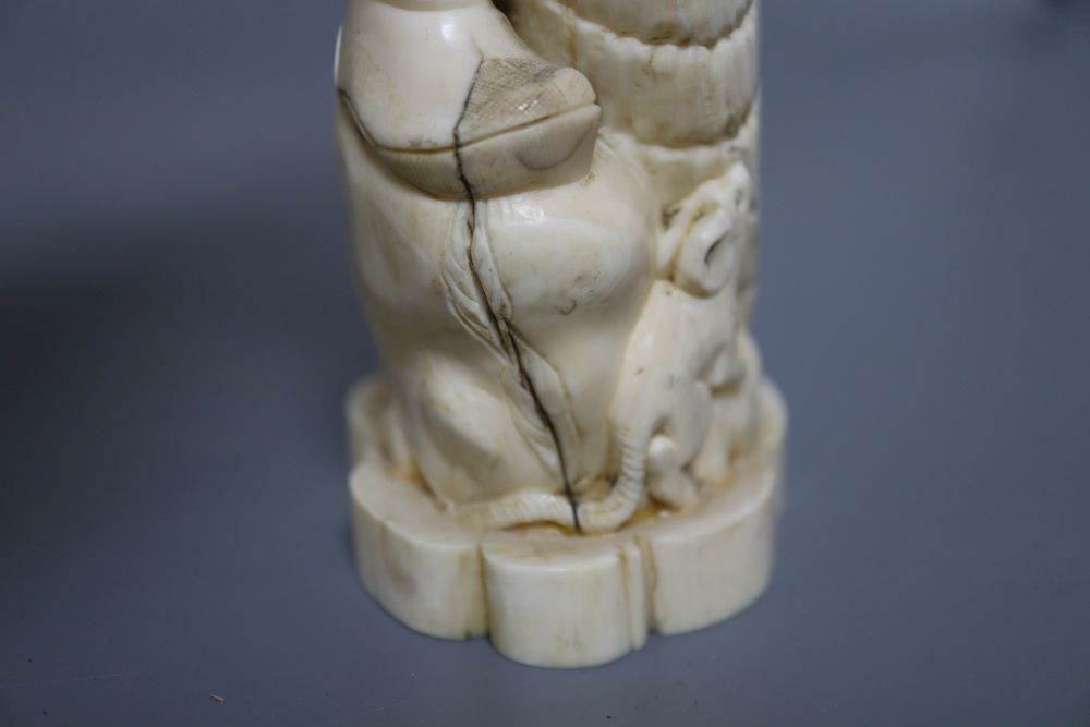 A Japanese ivory okimono of an elder and a dragon, and a marine ivory carving of Daikoku, tallest 25cm